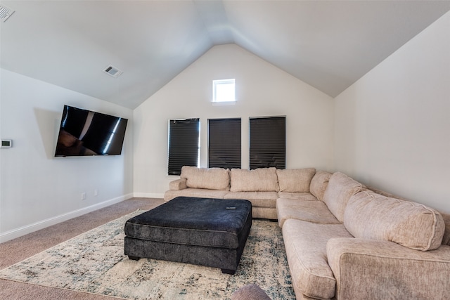 carpeted living room with lofted ceiling