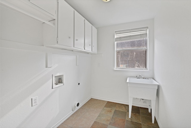 laundry area with electric dryer hookup, washer hookup, and cabinets