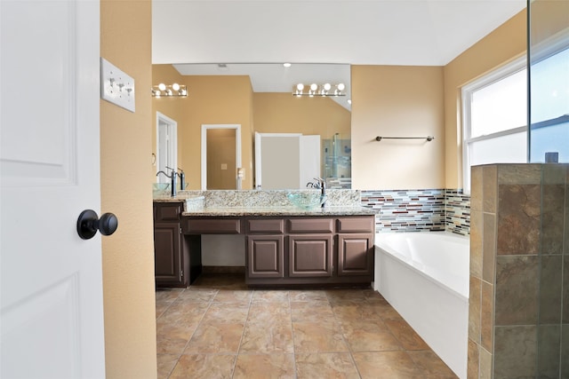 bathroom with vanity and a bathtub