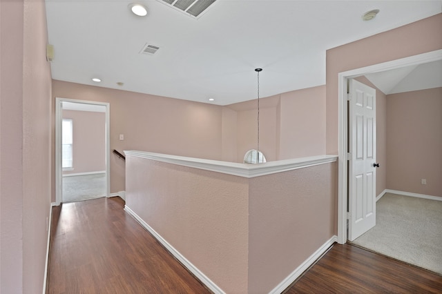 corridor featuring dark hardwood / wood-style flooring