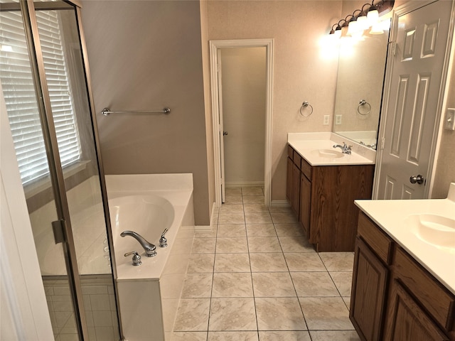 bathroom featuring shower with separate bathtub, tile patterned floors, and vanity