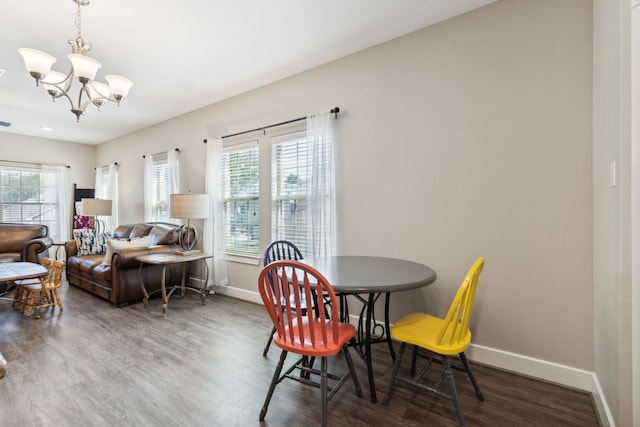 dining room featuring a notable chandelier and hardwood / wood-style flooring