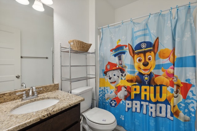 bathroom with vanity, toilet, and a shower with curtain