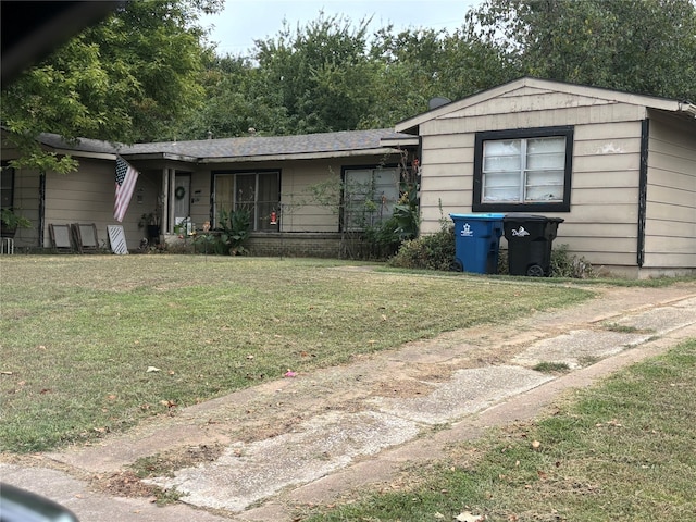 view of front of home featuring a front yard and a porch