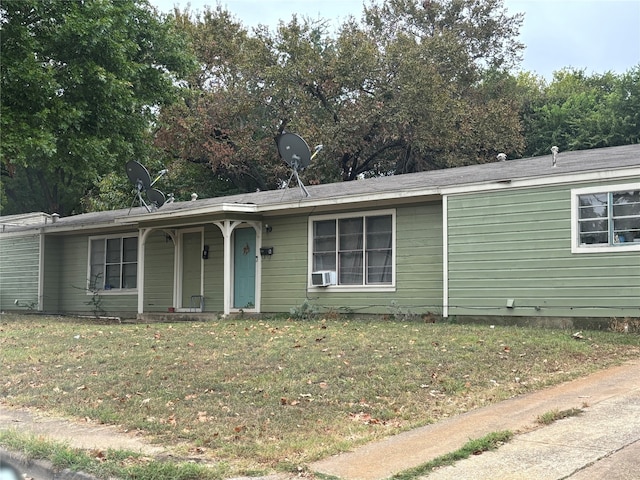 ranch-style house with a front lawn and cooling unit