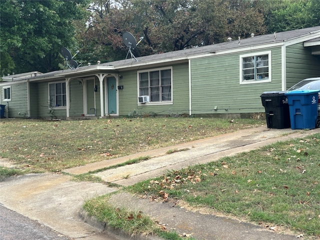 single story home featuring a front yard