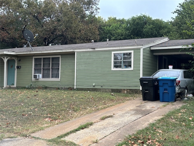 single story home with a front lawn and cooling unit