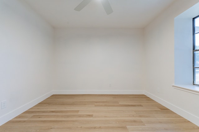 unfurnished room with light wood-type flooring and ceiling fan