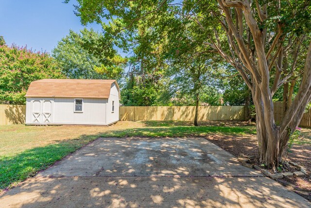 view of patio featuring a storage shed