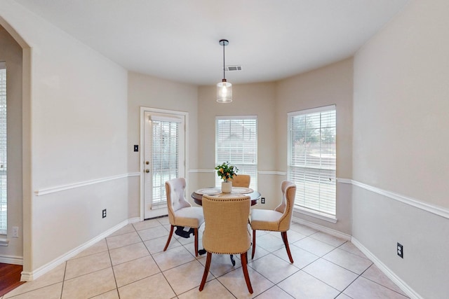 dining space featuring light tile patterned floors