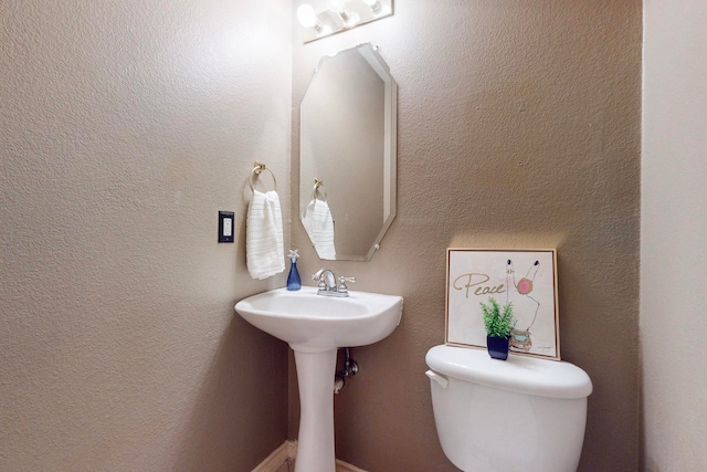 bathroom featuring toilet