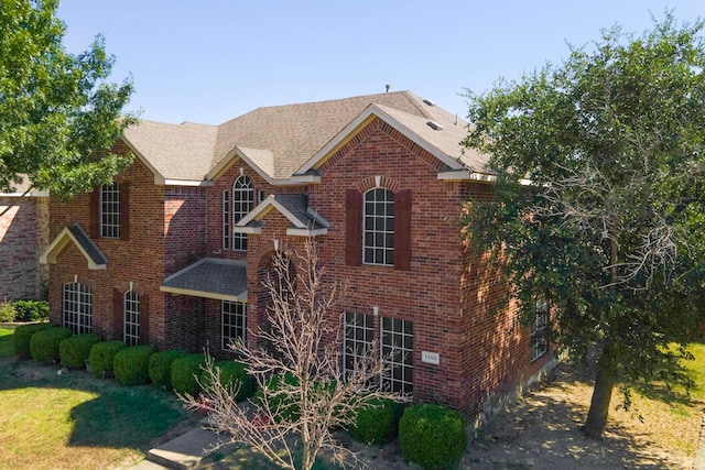 view of property with a front lawn