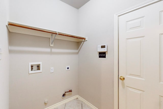 clothes washing area featuring hookup for a washing machine, light tile patterned floors, hookup for an electric dryer, and hookup for a gas dryer