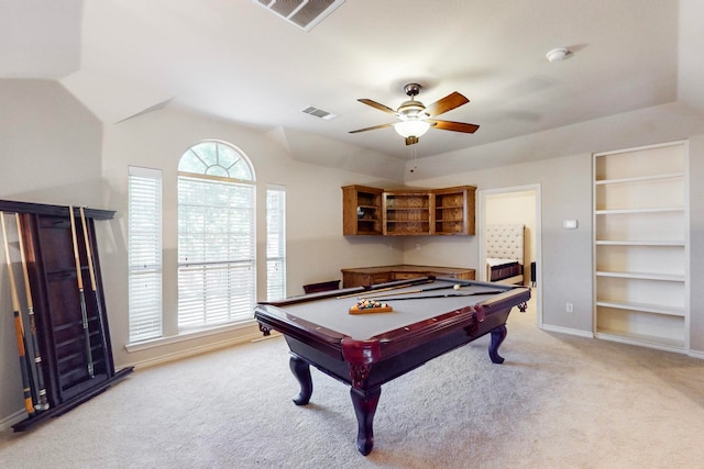 rec room with built in features, pool table, light carpet, and ceiling fan