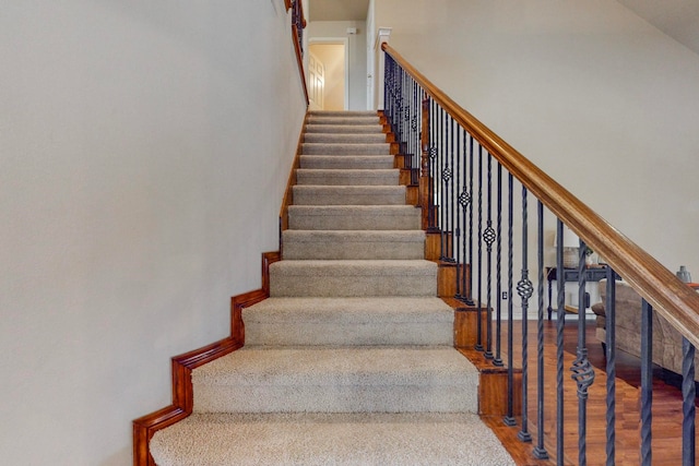 stairs with hardwood / wood-style flooring