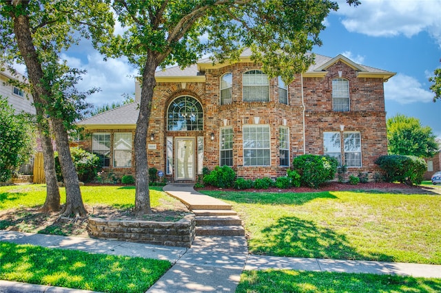 view of front of property with a front lawn