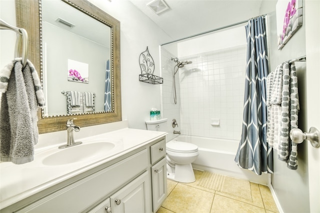 full bathroom featuring tile patterned floors, vanity, shower / bathtub combination with curtain, and toilet