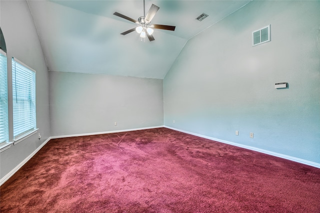 empty room with carpet, vaulted ceiling, and ceiling fan