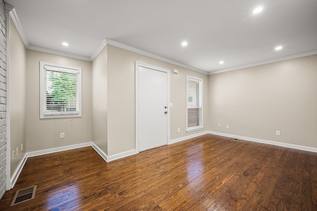 entrance foyer featuring crown molding and dark hardwood / wood-style floors