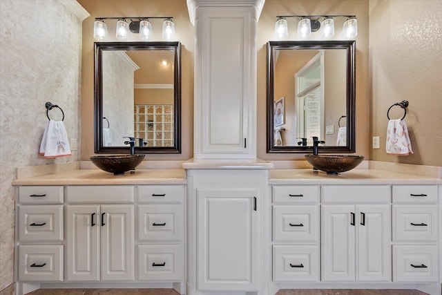 bathroom with vanity and ornamental molding