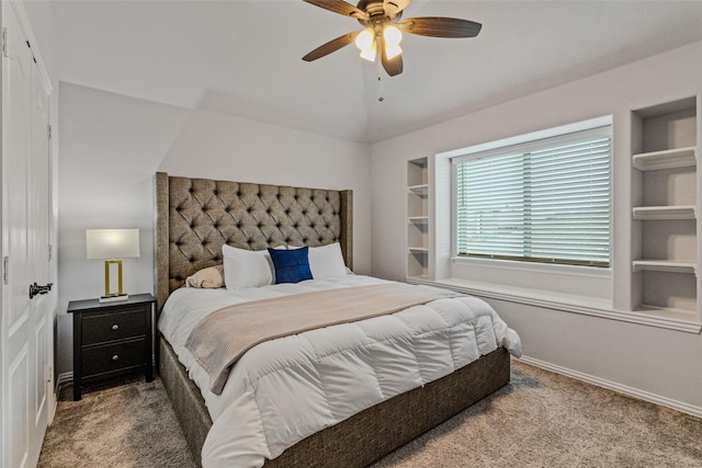 bedroom with vaulted ceiling, carpet flooring, and ceiling fan