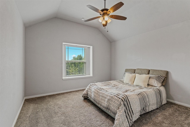 bedroom featuring ceiling fan, lofted ceiling, and dark colored carpet