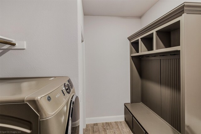 washroom featuring independent washer and dryer and light hardwood / wood-style floors