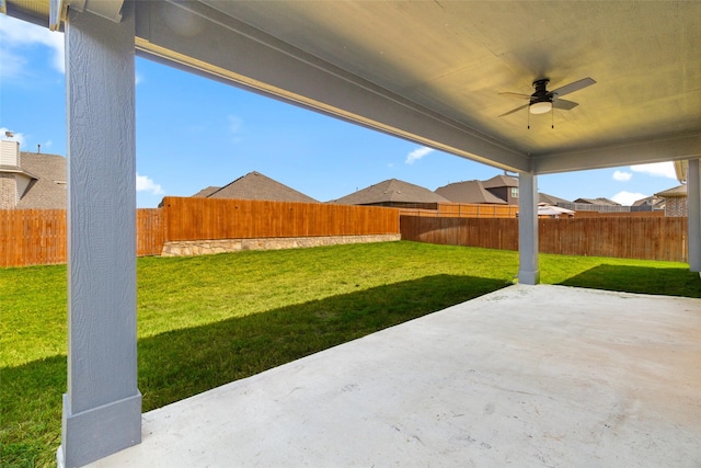 view of yard with a patio area, ceiling fan, and a fenced backyard