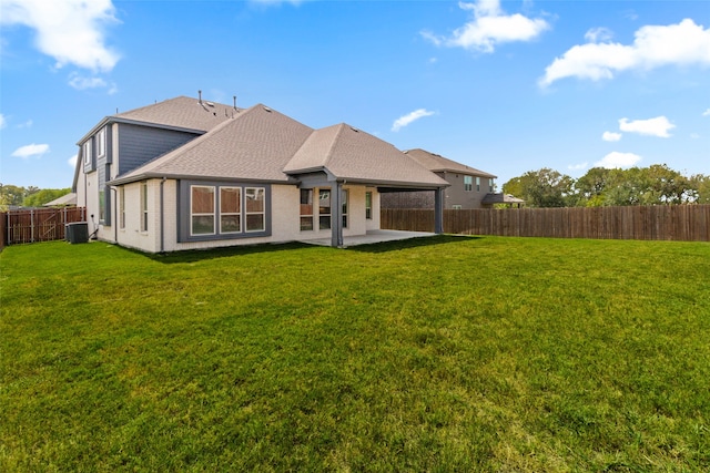 back of property featuring a yard, central AC unit, and a patio area