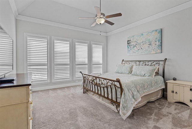 bedroom with vaulted ceiling, crown molding, light colored carpet, and ceiling fan