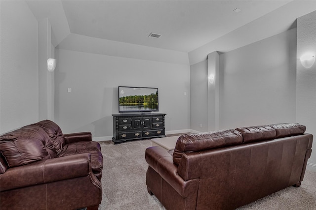 living room with vaulted ceiling and light carpet