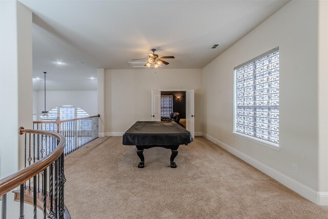 rec room with pool table, light colored carpet, and ceiling fan