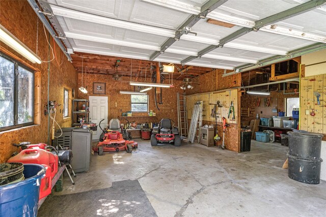 garage featuring a garage door opener and a workshop area