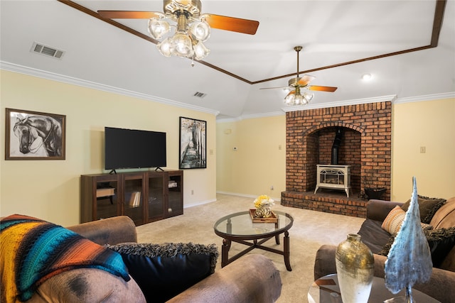 carpeted living room featuring ceiling fan, a wood stove, and ornamental molding