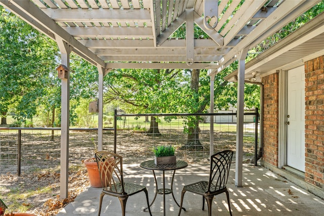 view of patio featuring a pergola