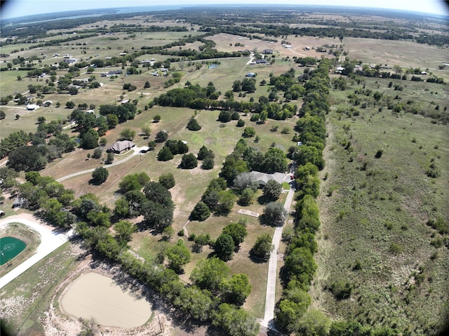 bird's eye view with a water view and a rural view