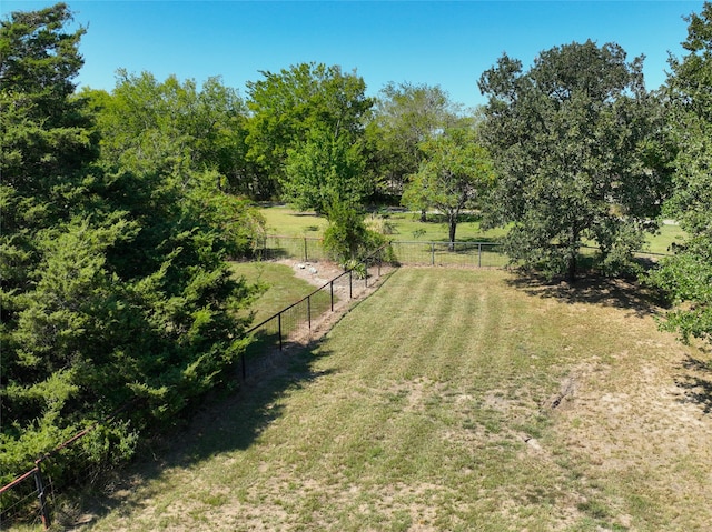 view of yard with a rural view