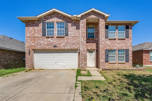 view of front of property with a garage and a front yard