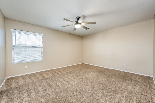 unfurnished room with carpet flooring and ceiling fan