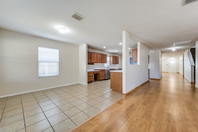 unfurnished living room featuring light wood-type flooring