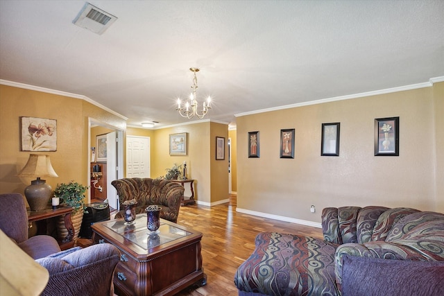 living room featuring an inviting chandelier, ornamental molding, and hardwood / wood-style flooring