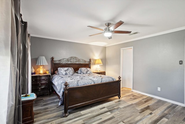 bedroom with ceiling fan, wood-type flooring, and ornamental molding