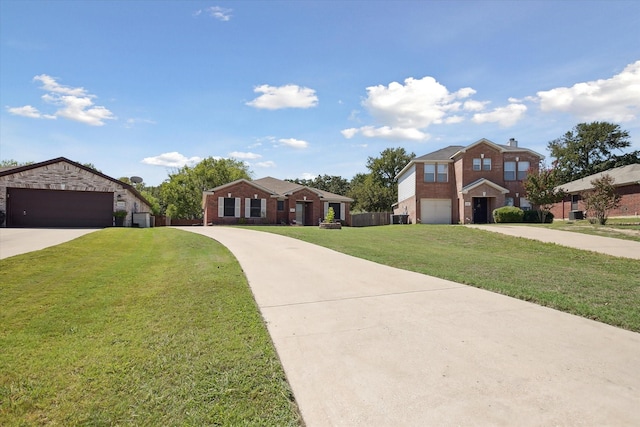 view of front of house with a garage and a front yard