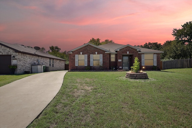 ranch-style house with a yard