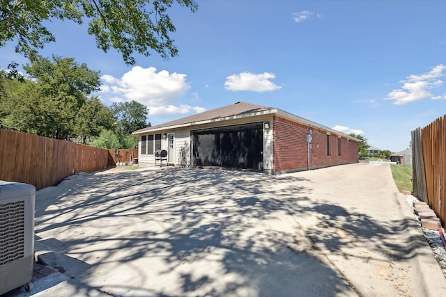 view of property exterior featuring a garage