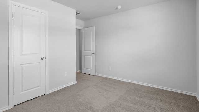 unfurnished bedroom with light carpet