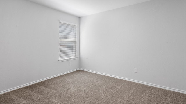 empty room with carpet flooring