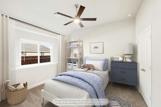 carpeted bedroom featuring ceiling fan and vaulted ceiling