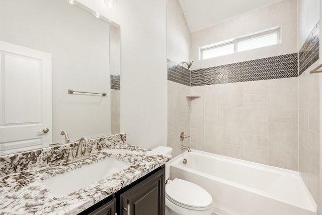 full bathroom featuring vanity, tiled shower / bath combo, and toilet