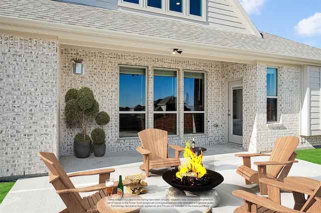 view of patio with a fire pit